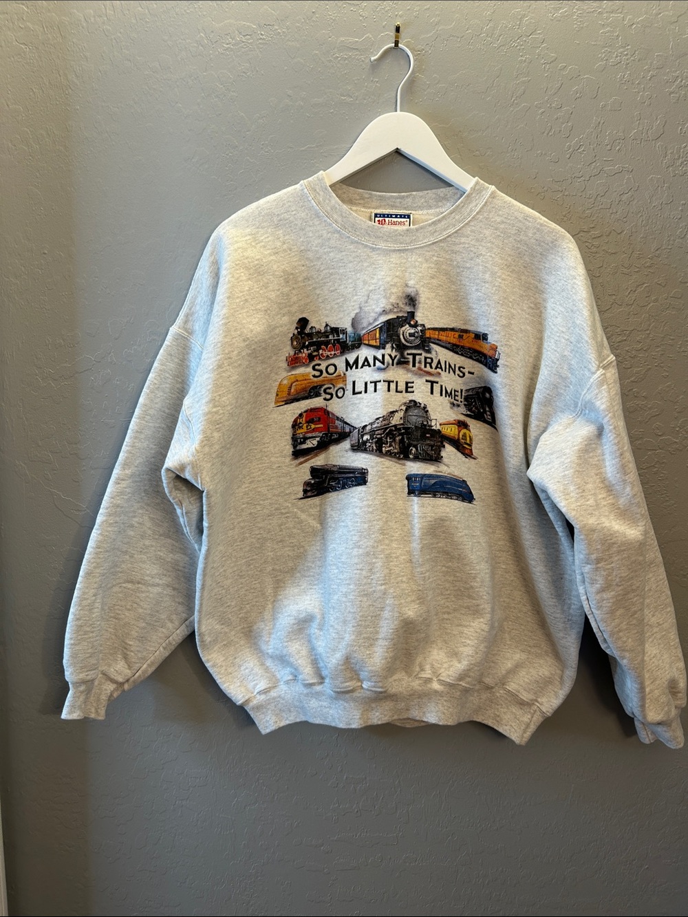 Hanes Grey Crewneck Sweatshirt with Colorful Train Graphic.